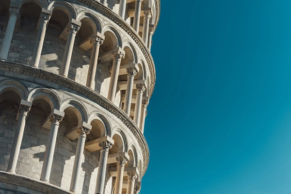 Close-up of the Leaning Tower of Pisa with clear sky in the background.