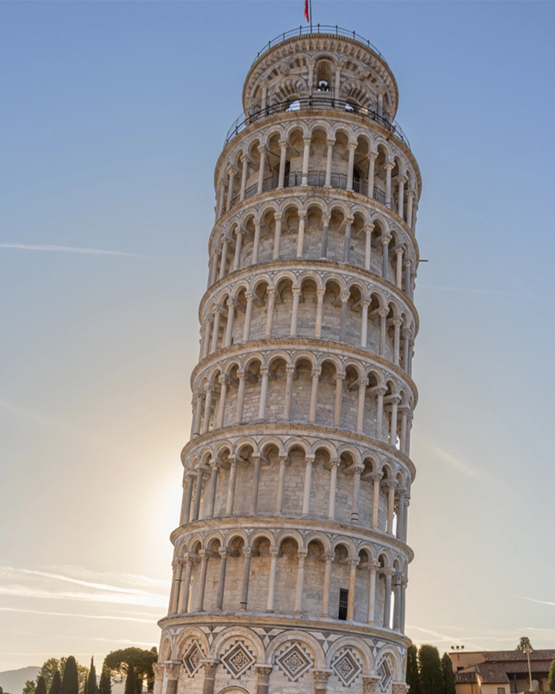 The Leaning Tower of Pisa, the sun rising in the background