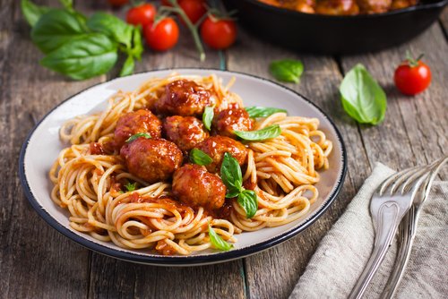 Spaghetti pasta with meatballs and tomato sauce, selective focus